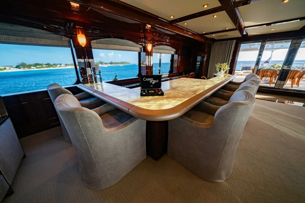 Luxury yacht salon with wooden furnishings and sea view
