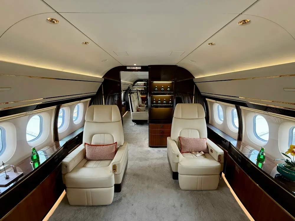 Private jet cabin with luxury leather seating